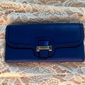Coach wallet. Minor wear and tear. No stains